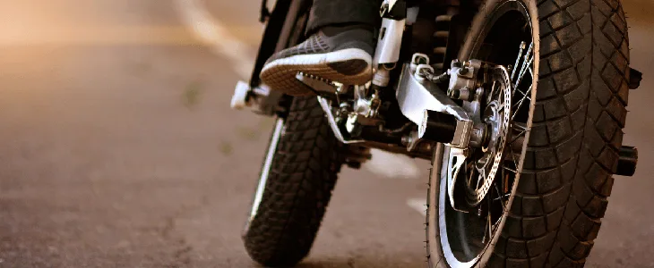 person on motorcycle about to create a motorcycle accident