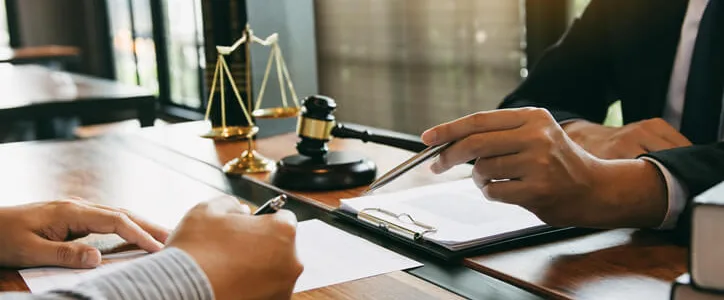 Personal Injury attorney sitting with client
