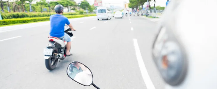 Two motorcyclists riding in the same lane